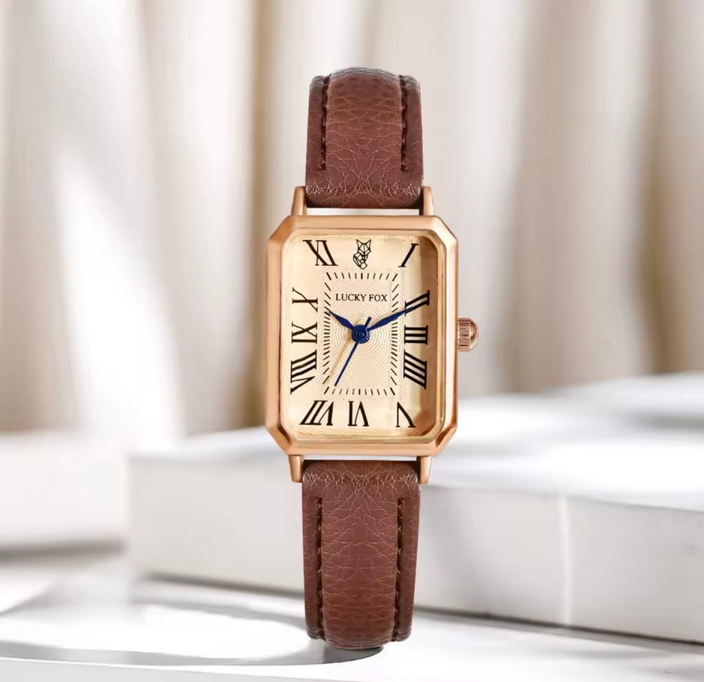Montre rectangulaire dorée bracelet marron